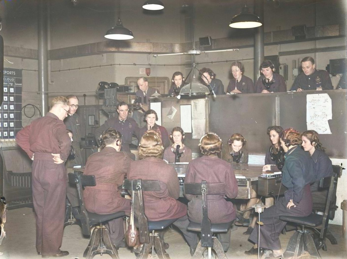 Men and women seated around a table in one of the observation posts