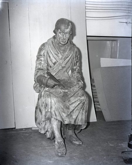 The statue of Watt in a sorry state in 1953, sitting in a store room