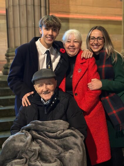 Outside Caird Hall is Joe with grandson Nathan Ogston, wife Joan, and grandaughter Shakira. Image: Supplied. 