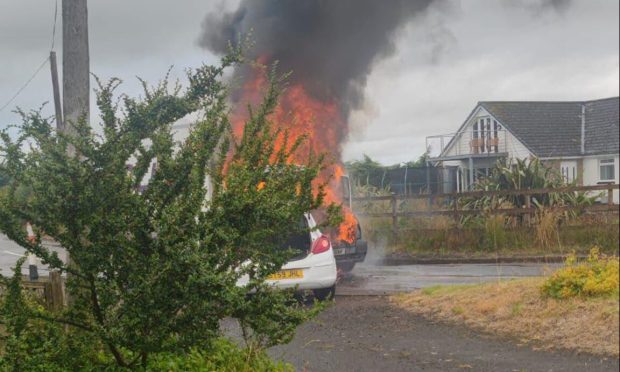 A fire after the crash on Drumsturdy Road at Newbigging. Image: Supplied