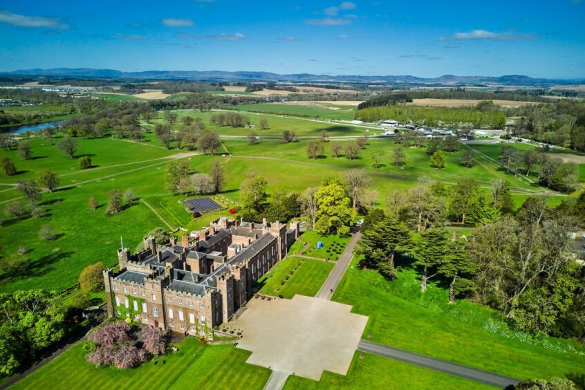 Aerial view of Scone Palace and grounds with racecourse behind