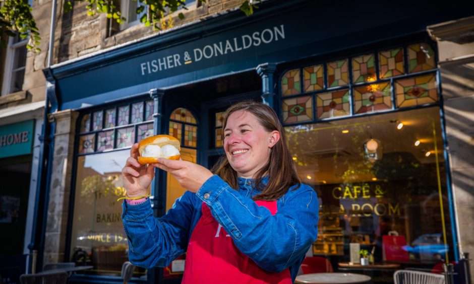 Chloe Milne, managing director of Fisher and Donaldson, eyes up the fudge doughnut ice cream sandwich.