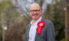 Brian Leishman wearing red Labour rosette