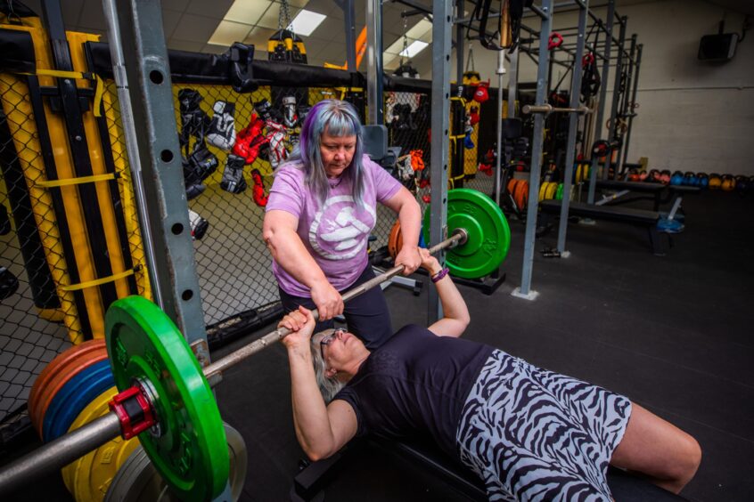 Strength coach Irene Hallyburton working with group member Heather McDonald at Omega MMA Gym in Perthshire.