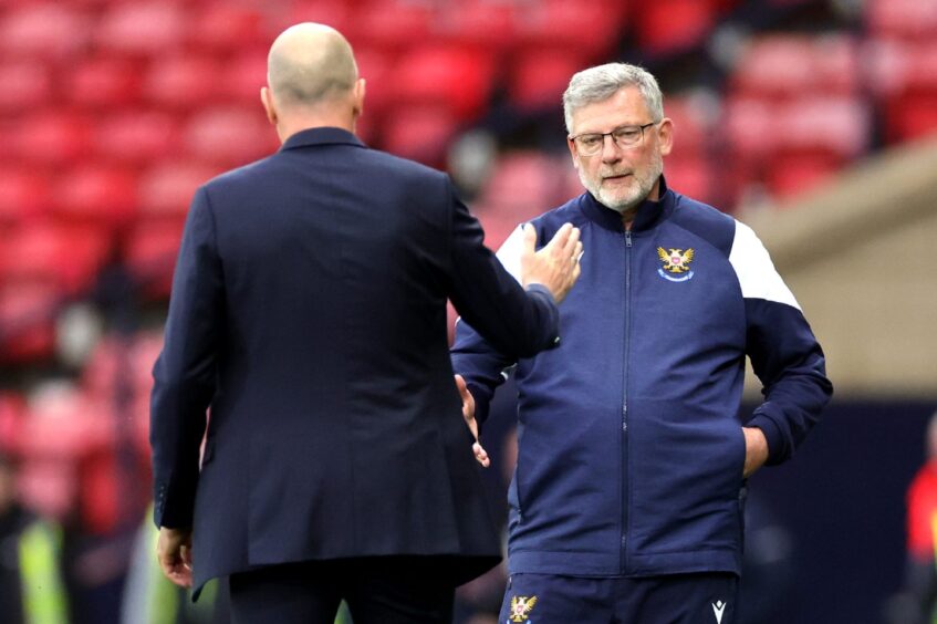 Craig Levein shakes hands with Rangers manager, Philippe Clement. 