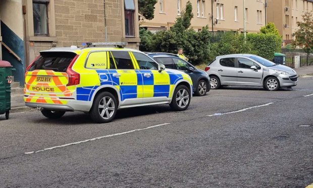 Police at the crash on Sandeman Street in Dundee. Image: Supplied