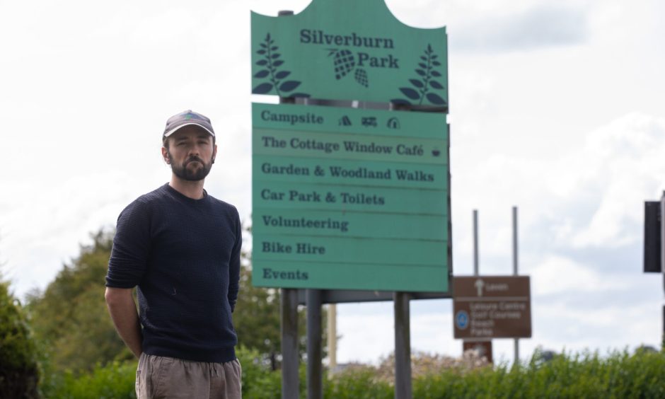 Silverburn Park bus stop cuts have saddened James Young, who is pictured at the park gate.