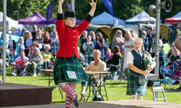 Image shows highland dancing at Perth Highland Games.