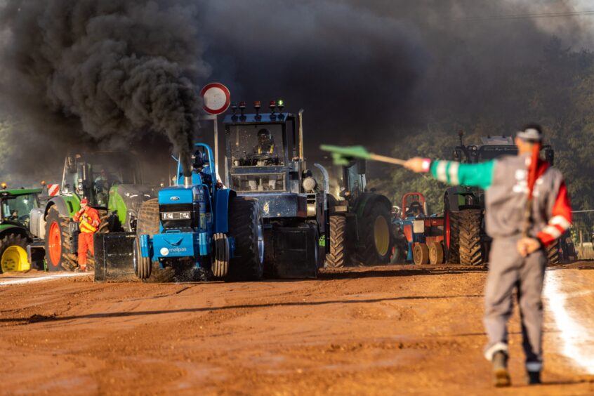 BESTPIC - CR0049457, Graham Brown, Brechin. Scottish Tractor Pulling Club event. Picture Shows: Super Farm section pull from Smokey 2 and the only female driver, Marie Cameron at the Scottish Tractor Pulling Club event in Brechin. Friday 9th August 2024. Image: Steve Brown/DC Thomson