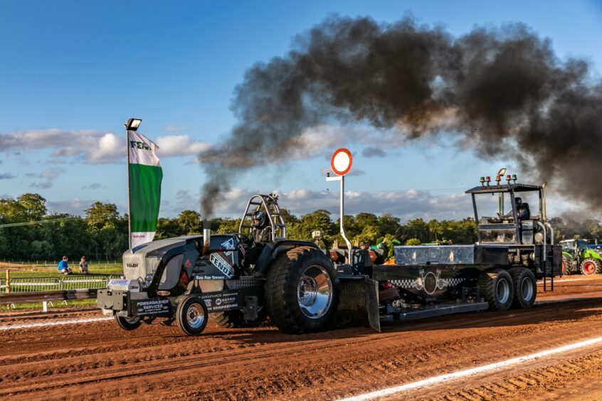 BESTPIC - CR0049457, Graham Brown, Brechin. Scottish Tractor Pulling Club event. Picture Shows: Super Farm section pull from Smokey 2 and the only female driver, Marie Cameron at the Scottish Tractor Pulling Club event in Brechin. Friday 9th August 2024. Image: Steve Brown/DC Thomson