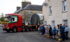 Lorrie reversing round tight corner in Dunning with large load on board