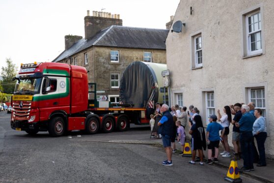 Lorrie reversing round tight corner in Dunning with large load on board