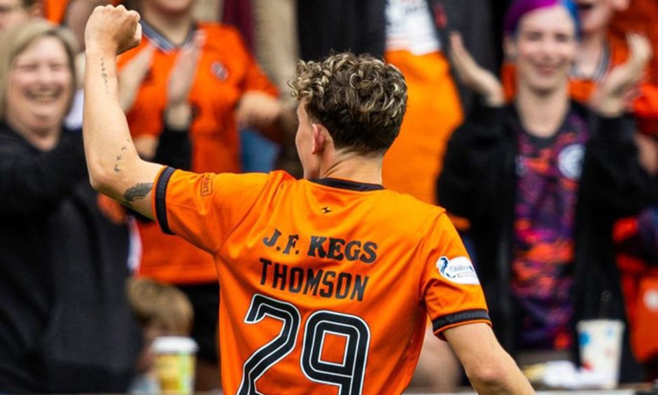 Dundee United winger Miller Thomson takes the acclaim of the Tannadice faithful