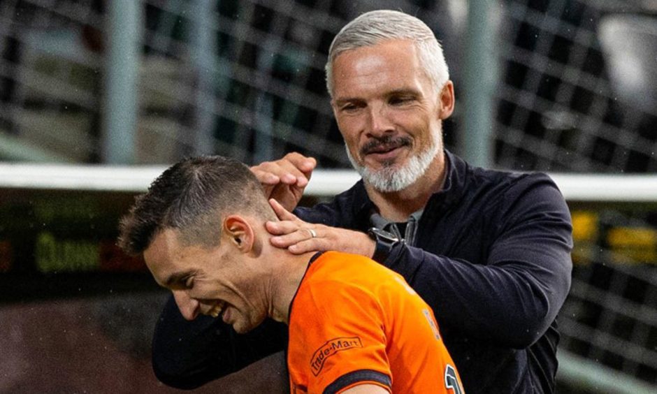 Dundee United's Jim Goodwin congratulates David Babunski