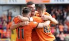 Dundee United's Ross Graham is congratulated by Will Ferry, left, and David Babunski