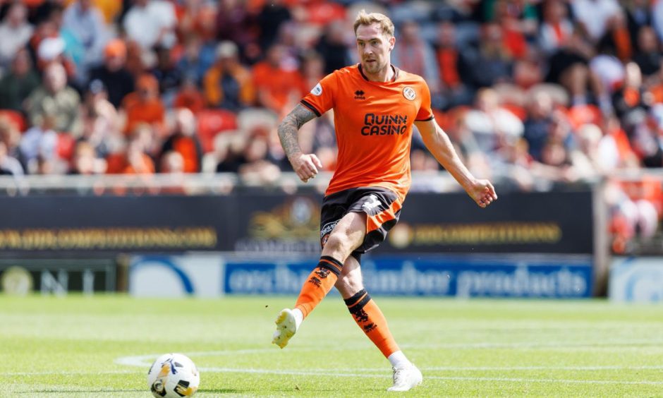 Dundee United's Kevin Holt spreading the play against St Mirren