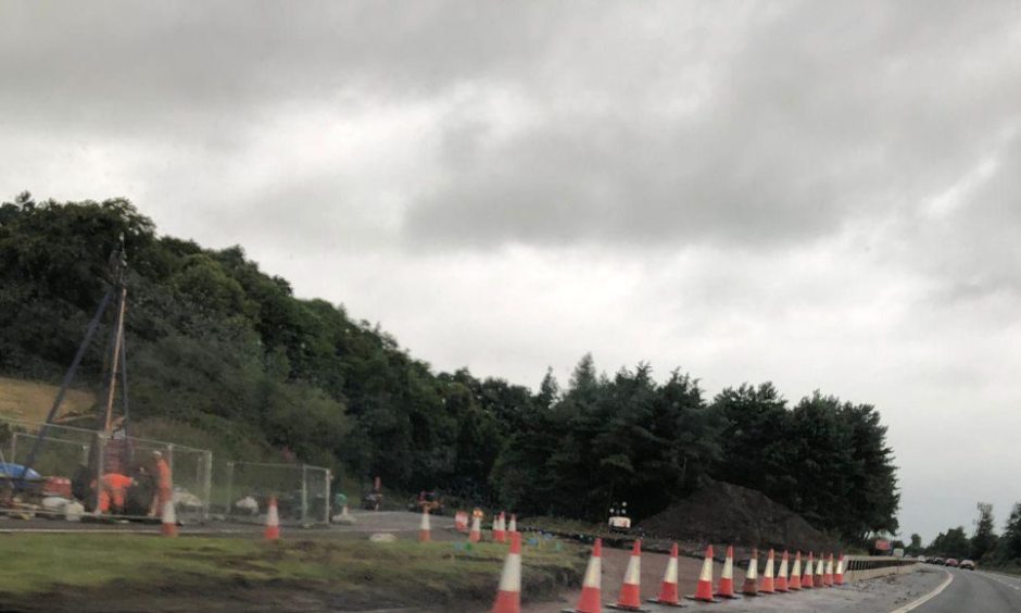 The temporary slip road on the M80 is under construction