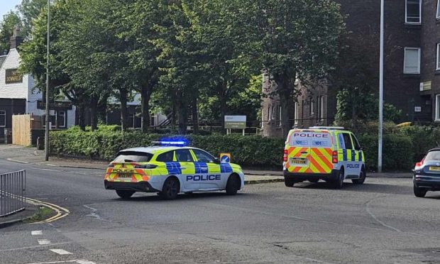 Police at Strathmartine Road, Dundee.