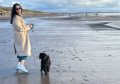 Kirsty and Buddy enjoying a beach walk. Image: Kirsty Strickland