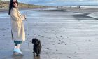 Kirsty and Buddy enjoying a beach walk. Image: Kirsty Strickland