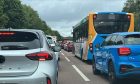 The queue of traffic approaching the bridge from Fife.