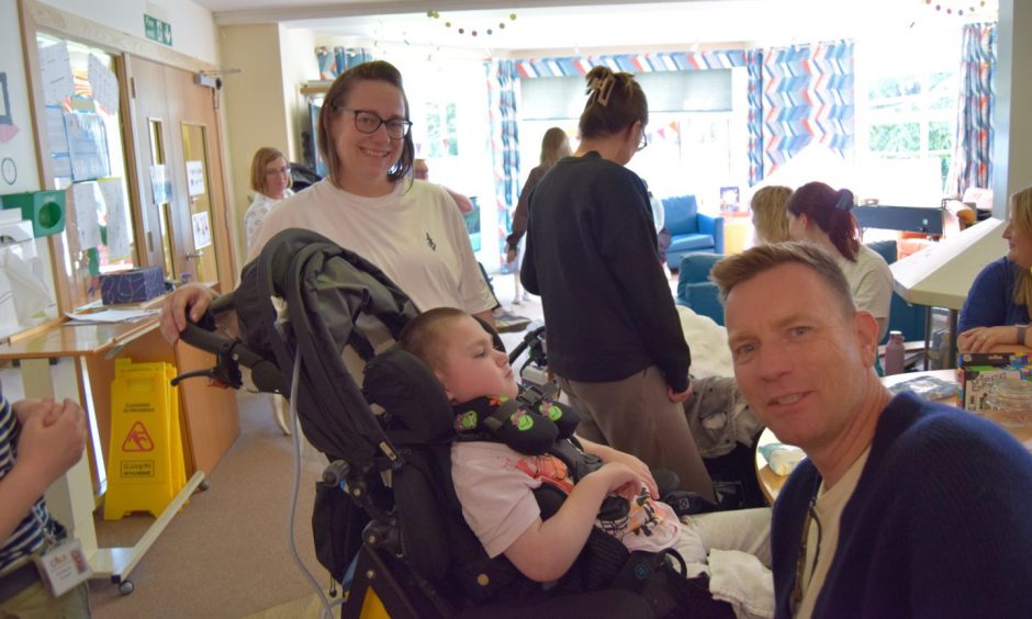 Ewan Mcgregor with Teddy Temple and mum Ceitidh at CHAS children's hospice, Kinross