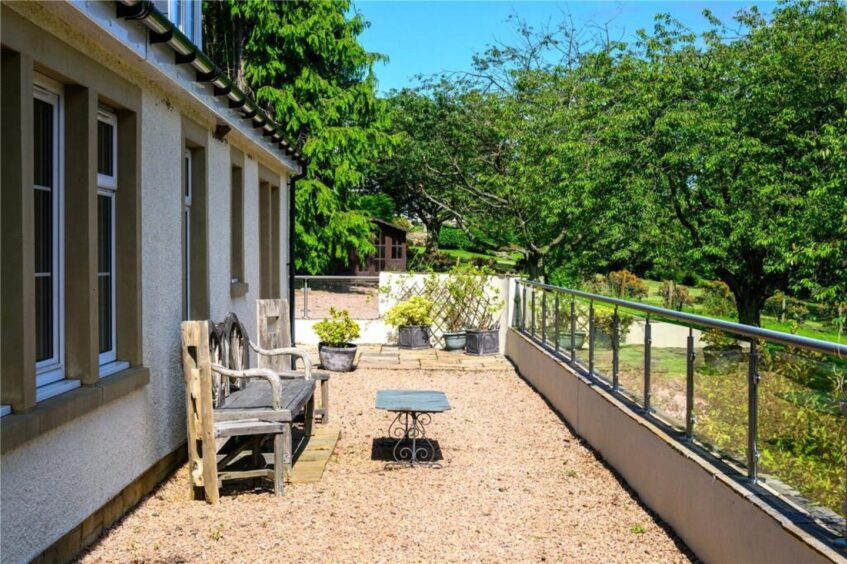 A terrace wraps round the house.