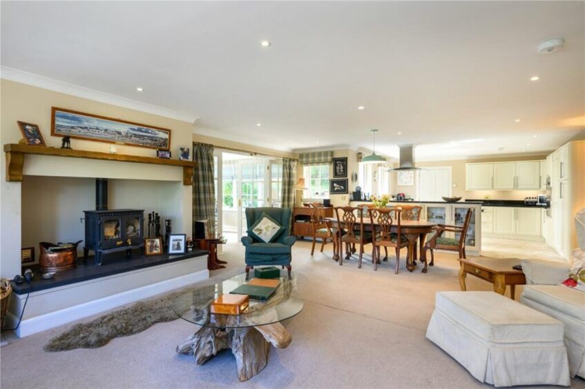 A fireplace sits at the heart of the living area.