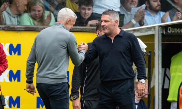 Dundee United boss Jim Goodwin shakes hands with Dundee counterpart Tony Docherty at last weekend's derby. Image: SNS. Tannadice Park, Dundee. Image: SNS