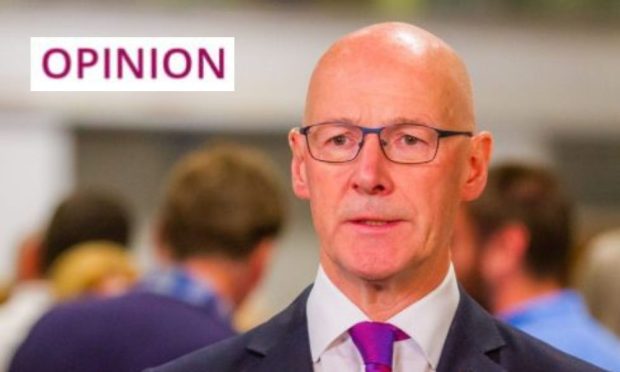 First Minister John Swinney.