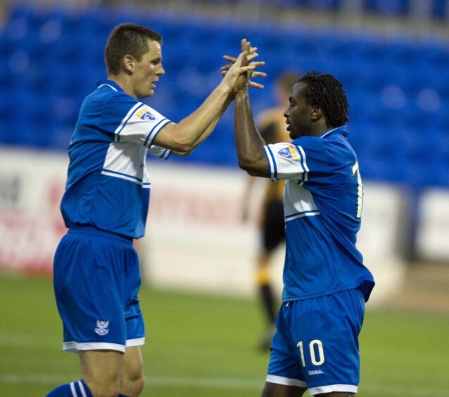 Martin Hardie celebrates with Jason Scotland after scoring St Johnstone's second goal against East Fife.