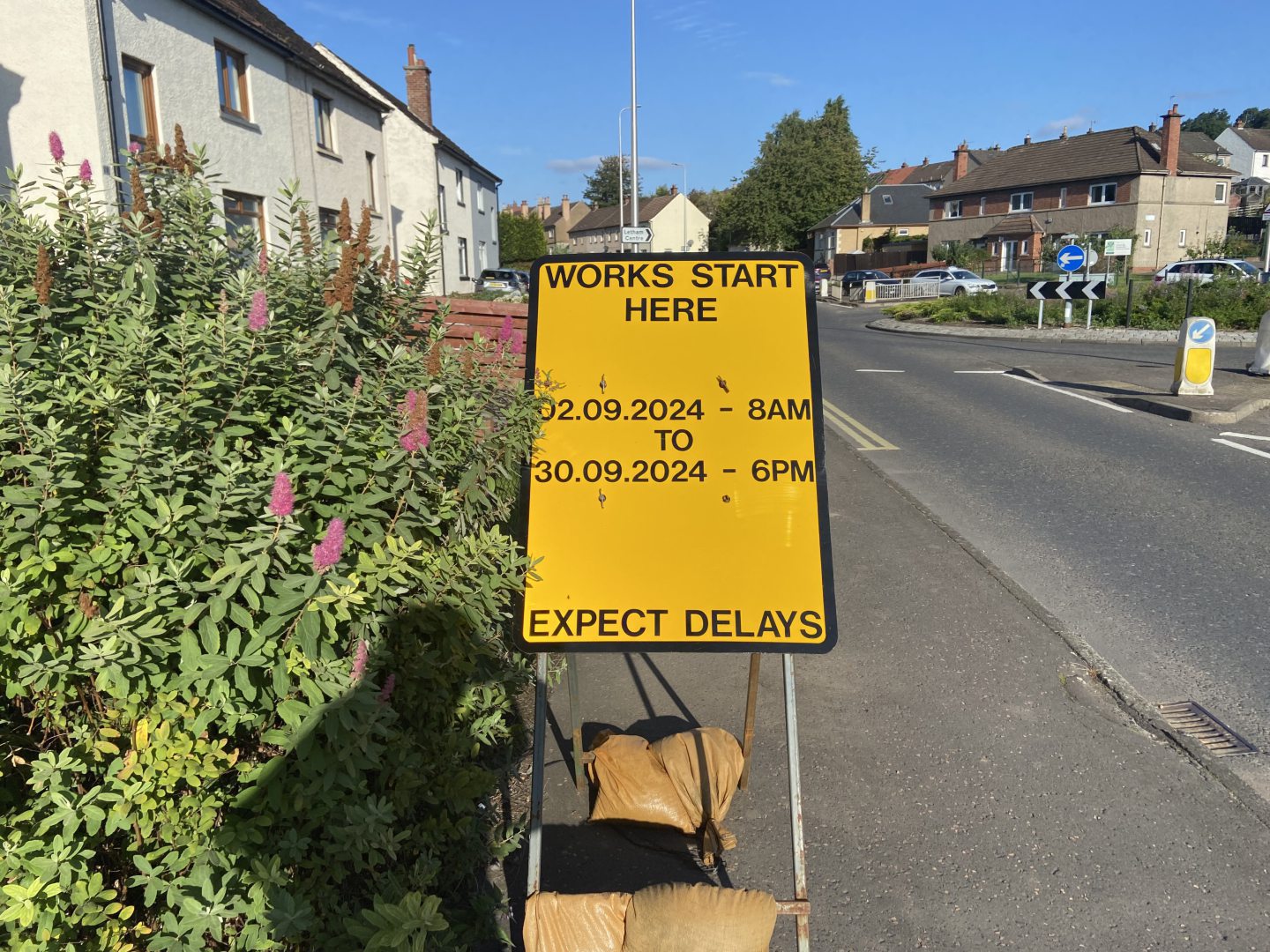 A signpost for roadworks starting next week.