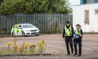 Police at the unit at Wester Gourdie Industrial Estate. Image: Mhairi Edwards/DC Thomson