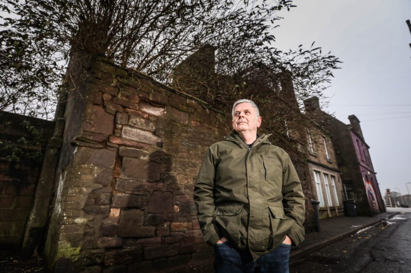 Charlie Malone standing in a Dundee street