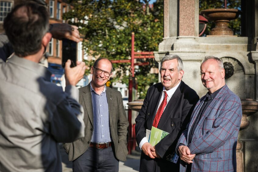 Jim Fairlie MSP, councillor Stewart Donaldson and Pete Wishart MP being photographed next to Murray fountain, Crieff