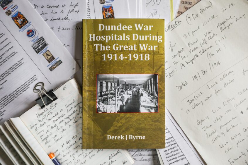 The book about Dundee war hospitals sits among Derek's notes. 