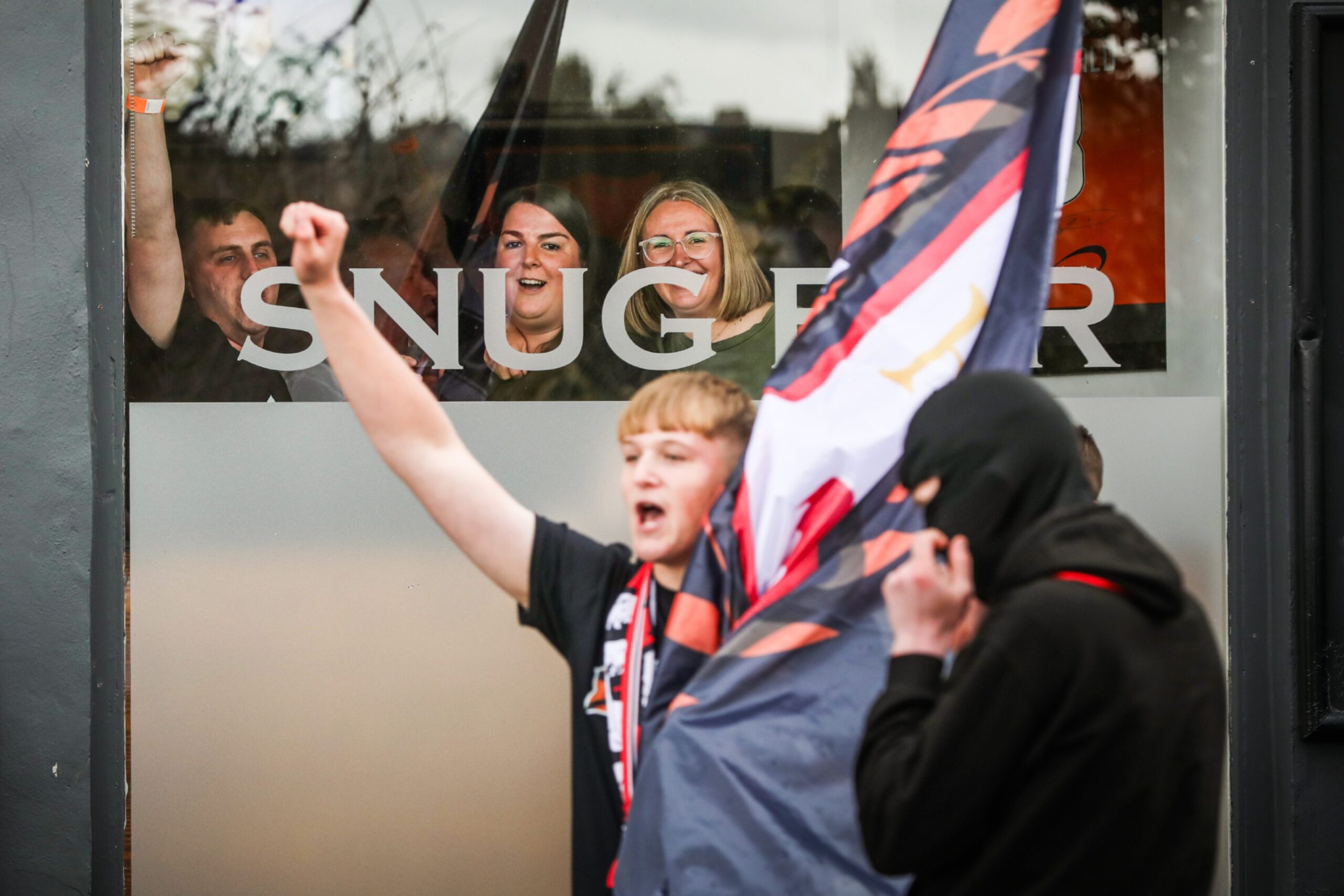 Fans inside Snug Bar spotting the cameras.