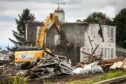 BESTPIC CR0049759, Laura Devlin, Dundee, The bottom half of the original Ellengowan Drive houses in Dundee are currently getting demolished to make way for a new housing development by Hillcrest.  Picture shows; the demolition taking place on Ellengowan Drive. Thursday 29th August, 2024. Image: Mhairi Edwards/DC Thomson