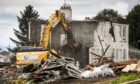 BESTPIC CR0049759, Laura Devlin, Dundee, The bottom half of the original Ellengowan Drive houses in Dundee are currently getting demolished to make way for a new housing development by Hillcrest.  Picture shows; the demolition taking place on Ellengowan Drive. Thursday 29th August, 2024. Image: Mhairi Edwards/DC Thomson