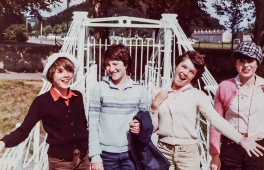 four children pose for a pic beside a park bridge in Inverness on a 1979 trip.