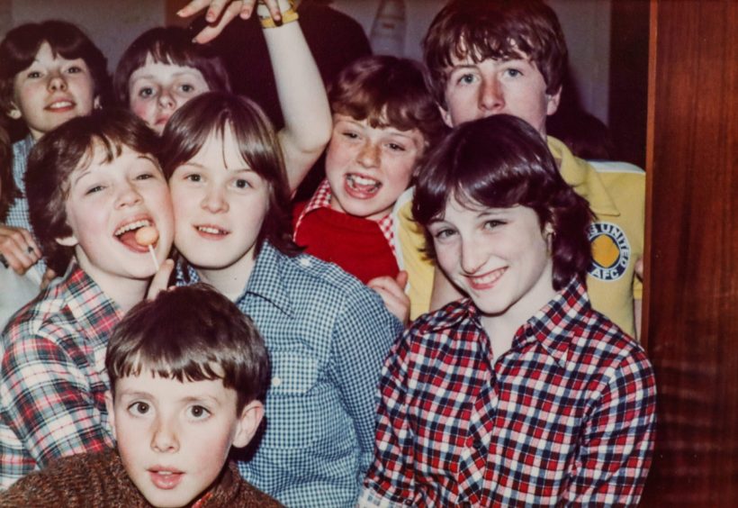 a group of boys smile for the camera on a Kinloch Rannoch trip in April 1979. 