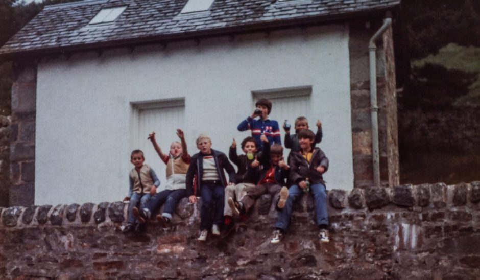 members of the 5-11 Club sitting on a wall at Kinloch Rannoch in July 1981.