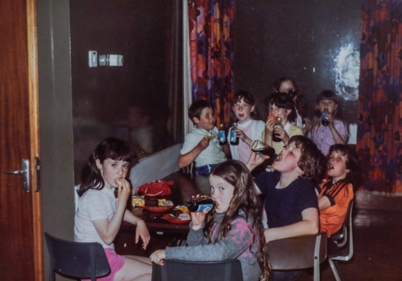 kids tucking in at a tuck shop for the 5-11 Club at Kinloch Rannoch in July 1979. 