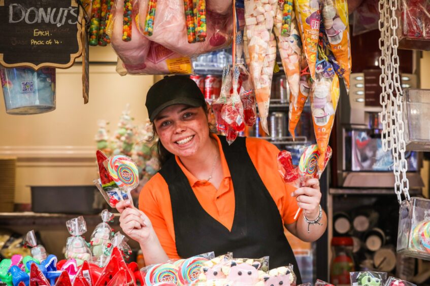 Tyra Sedgwick, assistant in Chips, Burgers, Chicken, with some of the sweet treats on offer.