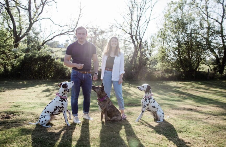 Gordon McGuire and Katie Gardner with Suki the dog and their two dalmations