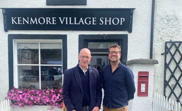 John Swinney standing outside Kenmore village shop with Chris Rowley