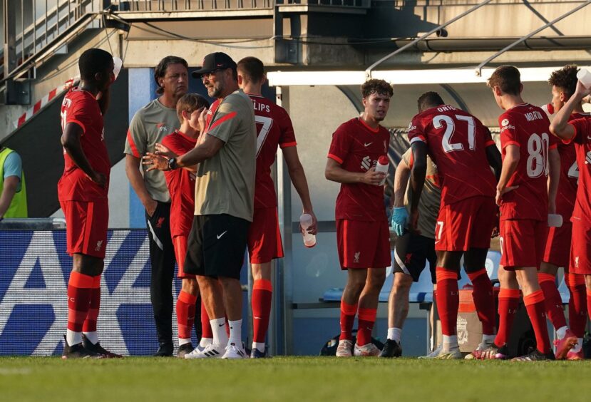 Billy Koumetio gets tips from Liverpool legend Jurgen Klopp on a pre-season trip to Austria in 2021. Image: Shutterstock