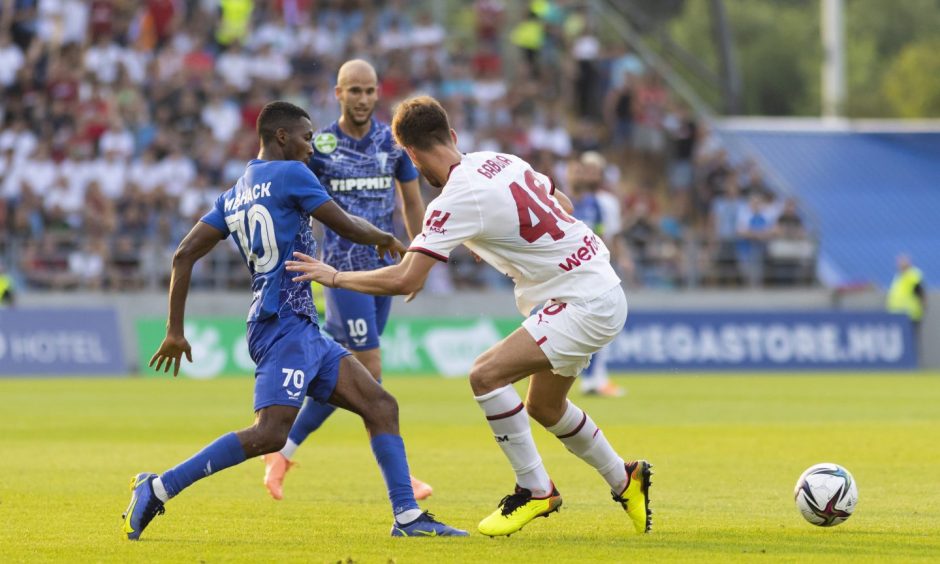 Meshack Ubochioma, left, in action in Hungary a friendly against Milan.