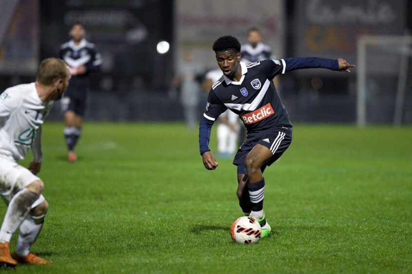 Julien Vetro with the ball at his feet while playing for Bordeaux, preparing to go past a defender