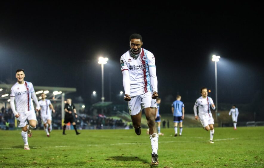 Emmanuel Adegboyega celebrates finding the net for Drogheda.